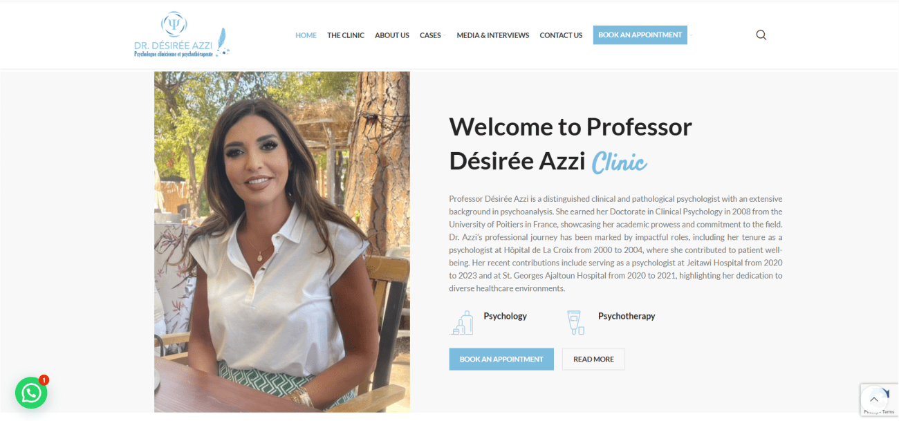 Dr. Désirée Azzi, clinical and psychoanalytic psychologist, smiling outdoors, wearing a white blouse, with trees in the background, reflecting her approachable and professional demeanor.