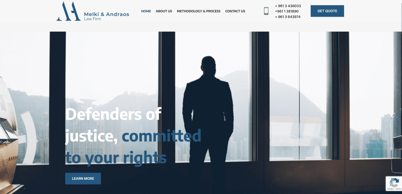 Silhouette of a professional man in a suit standing by a large window, overlooking a cityscape, with text overlay stating "Defenders of justice, committed to your rights," representing Melki & Andraos Law Firm's commitment to high-quality legal services.