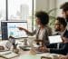 Professionals collaborating on online reputation management strategies in a modern office