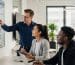 Professionals collaborating on social media analytics in a modern office
