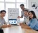 Marketers collaborating over social media performance metrics in a bright, modern workspace